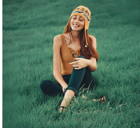 Woman Hanging Out in the Grass- Enjoying Her Bonus Points
