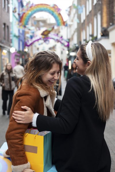 Women Hugging at Parade