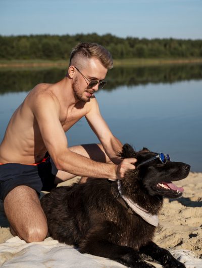 August Man Hanging with his Dog